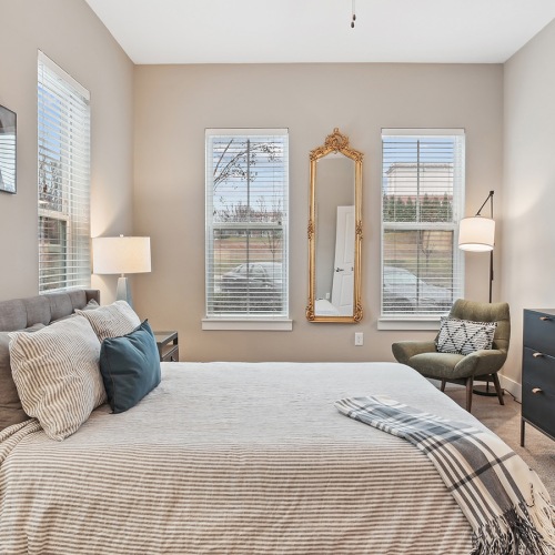 Beautiful bedrooms to fit every need bedroom with bed and wall art