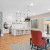 lounge style room with lots of seating and a bar area