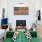 a club room with a green couch