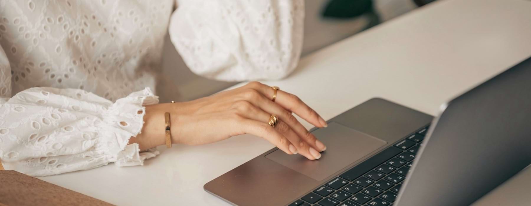 a woman typing on a computer